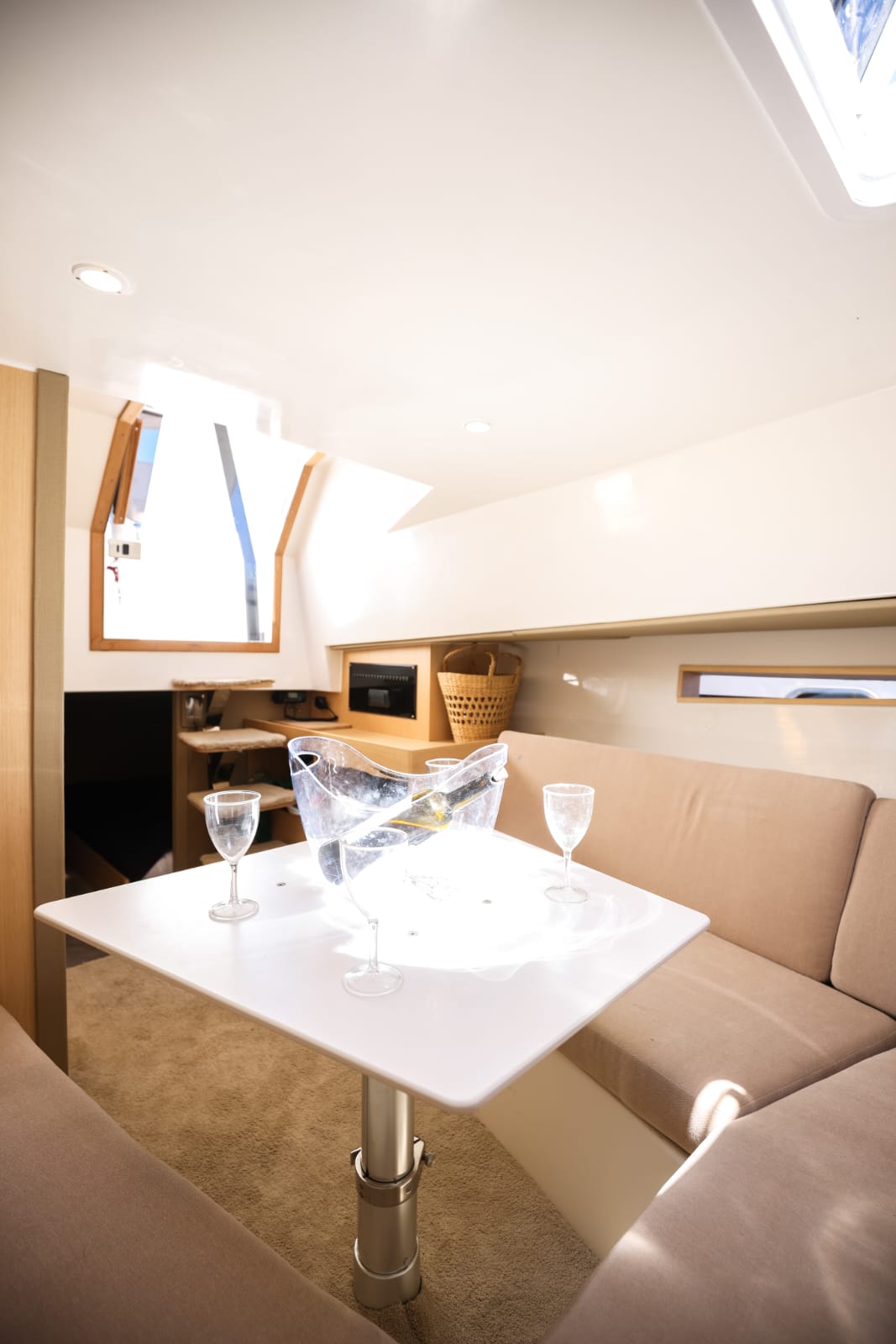 Yacht anchored in secluded cove with emerald green waters