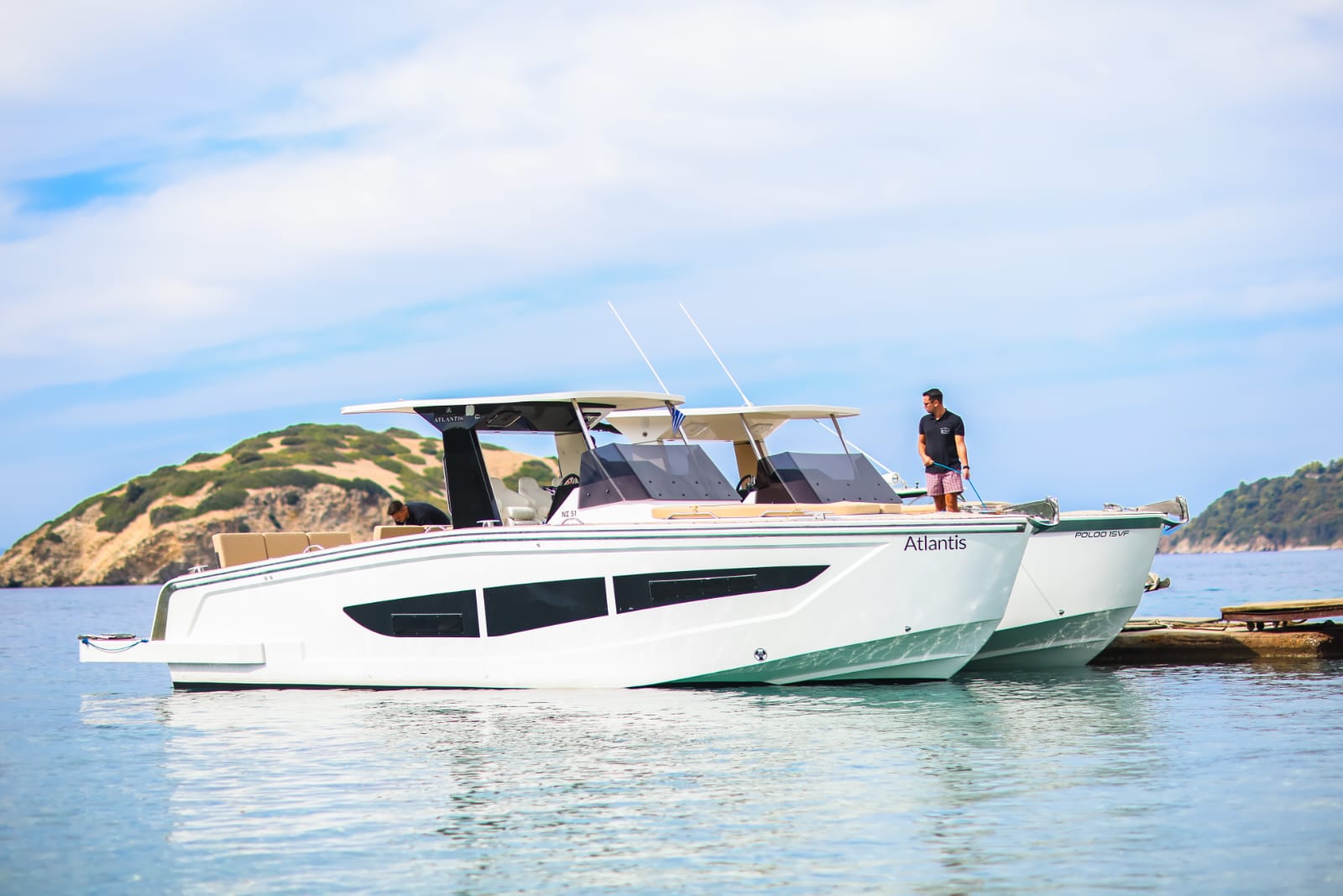 Luxury yacht Atlantis anchored in crystal clear turquoise waters